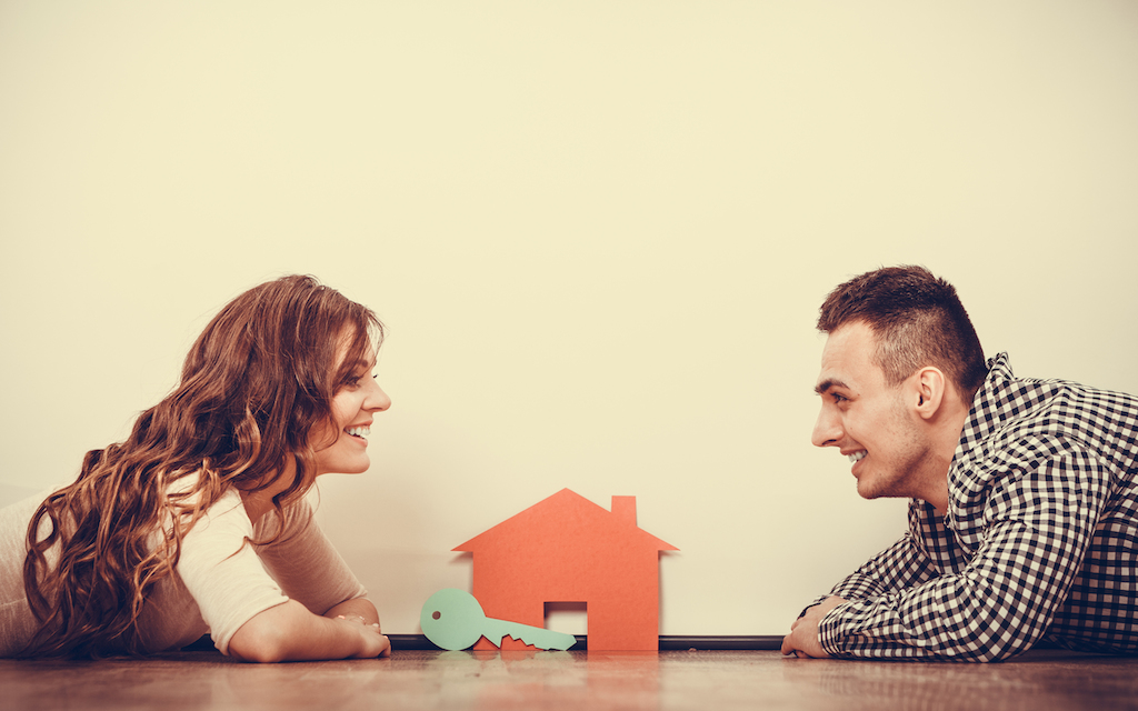 Couple discussing questions to ask their investment property manager